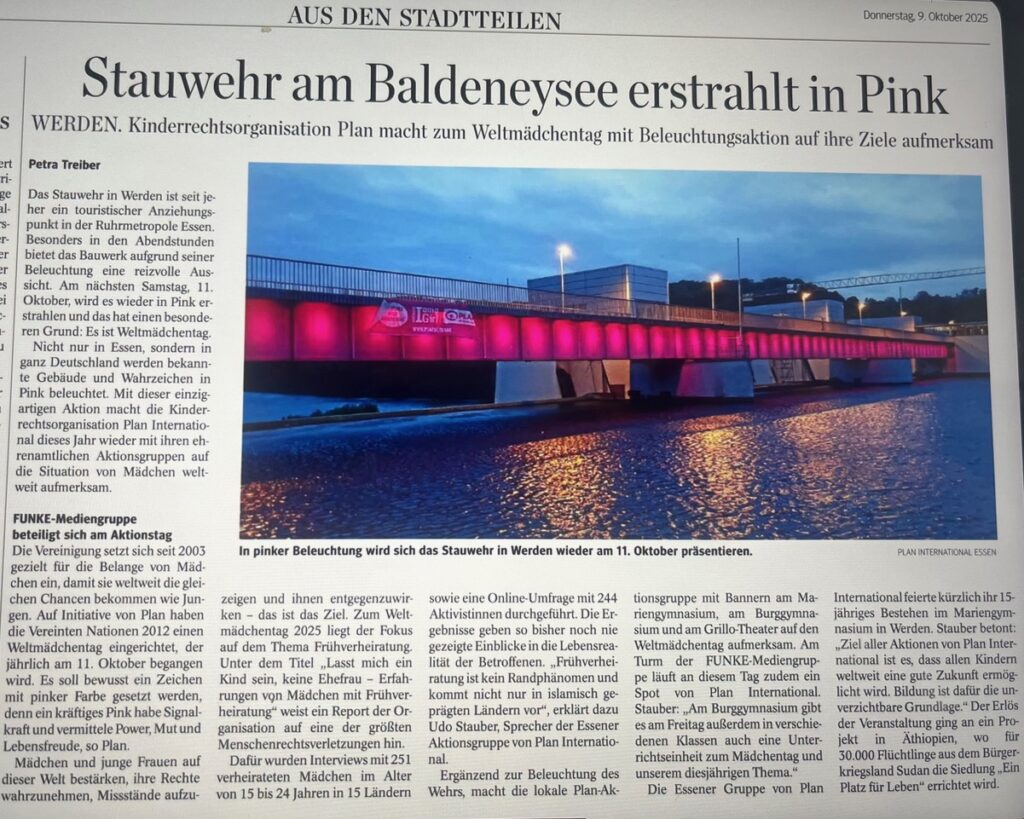 A newspaper article with a large photo showing the Baldeneysee bridge in Werden illuminated in bright pink lights at night, reflecting on the water below. The headline highlights the pink lighting event.